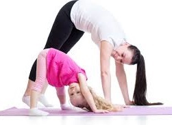 Mom and child doing yoga