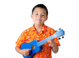 Child playing the ukulele