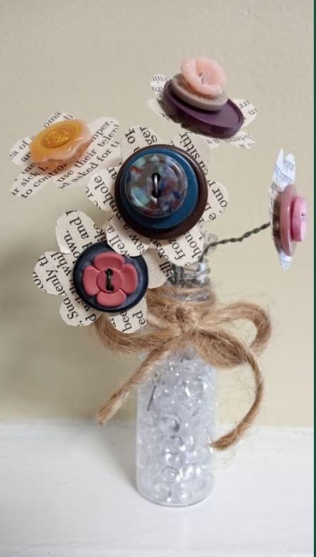 Photo of a book page and button bouquet.