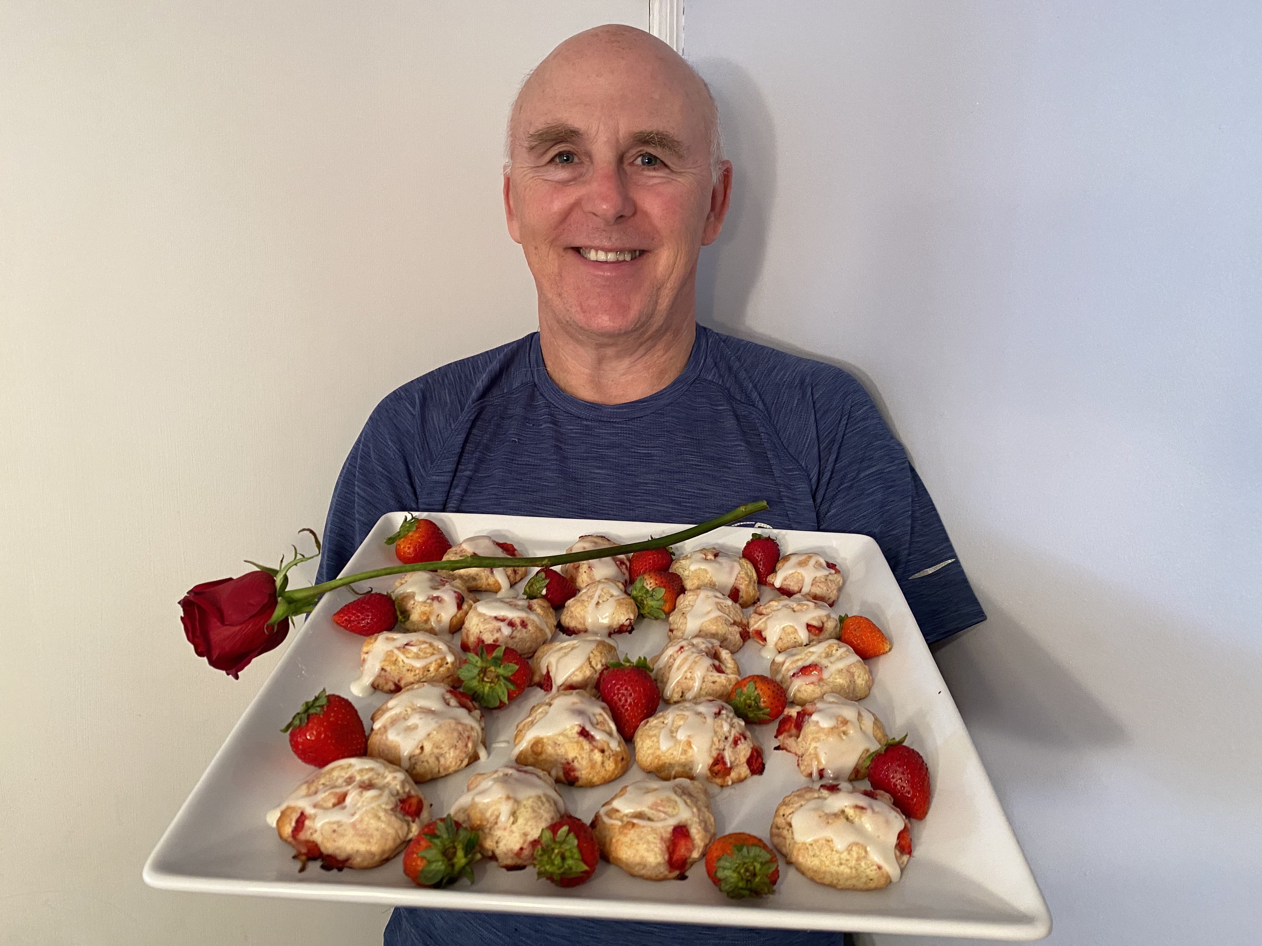Photo of Chef Rob holding a plate of Valentine Strawberry Biscuit Cookies.