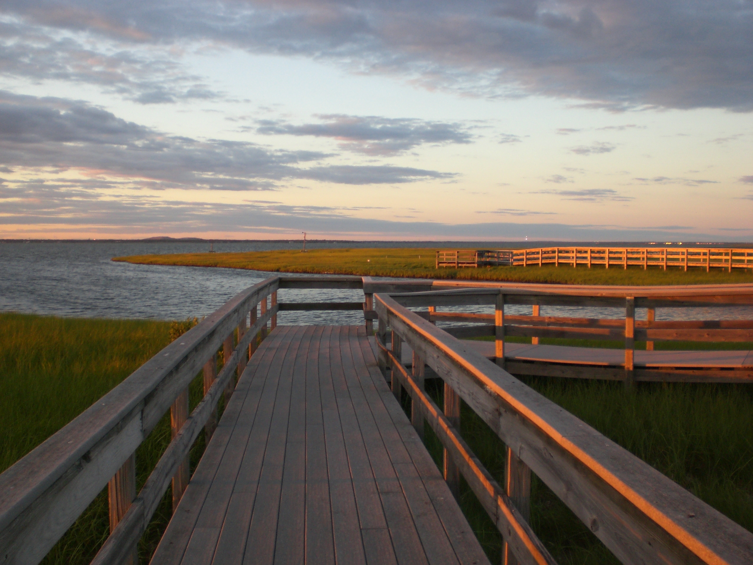Photo of a dock at sunset on Fire Island.