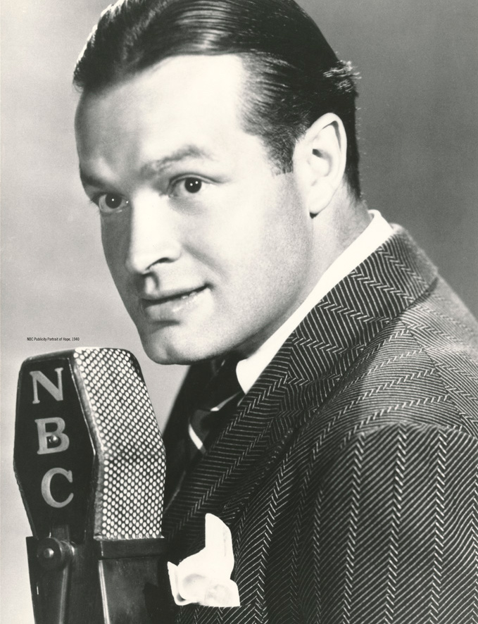 NBC's black and white publicity photo of a young Bob Hope at an NBC microphone, circa 1940.
