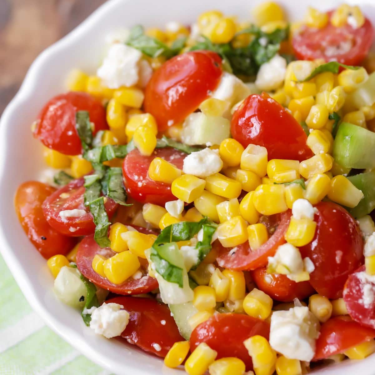 Photo of a bowl of Fresh Corn, Mozzarella and Tomato Salad.
