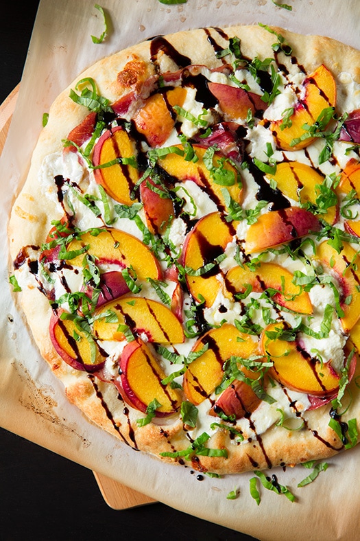 A photo of Grilled Flatbread with Peaches, Prosciutto and Balsamic Drizzle.