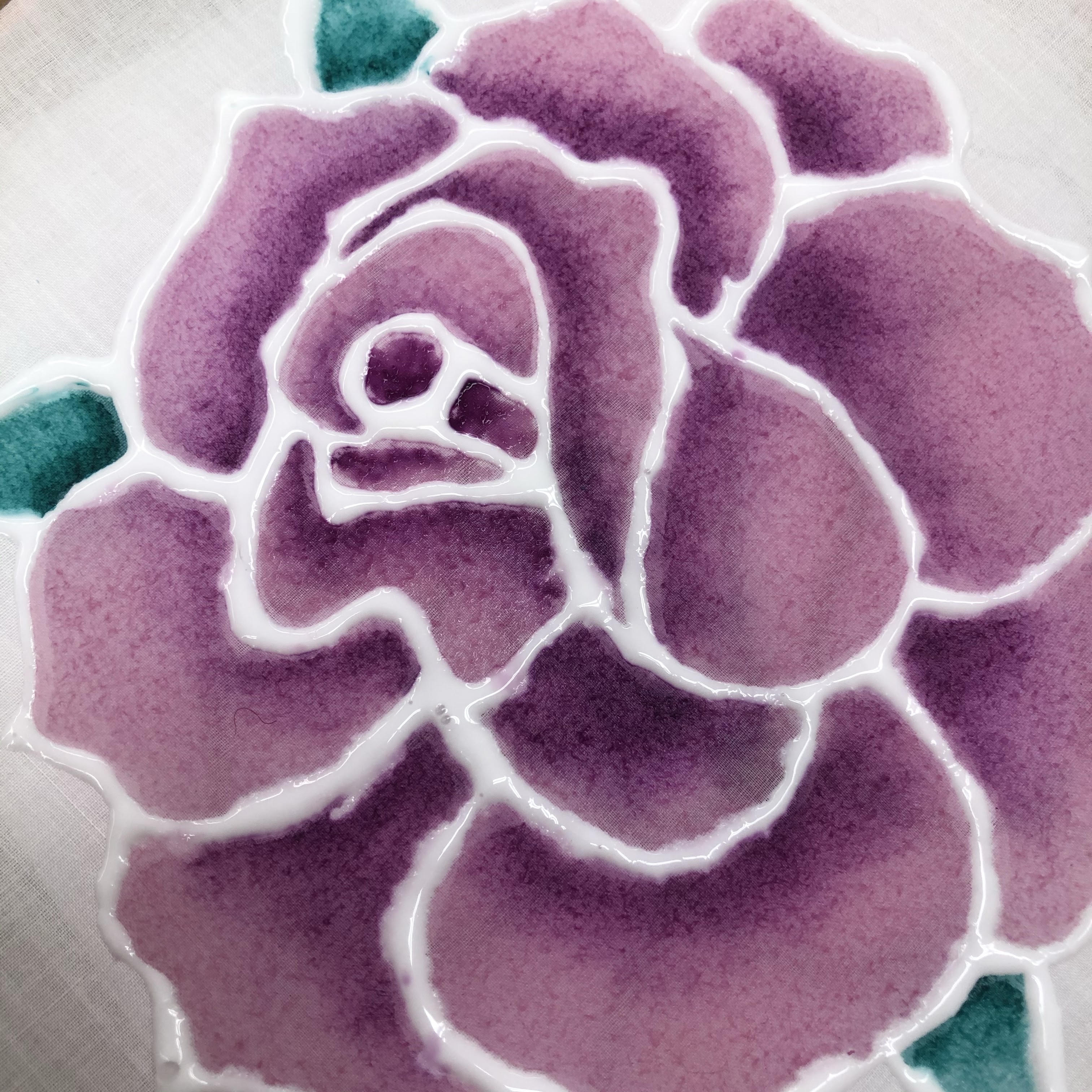 Photo of a lavender flower painted on a white silk background.