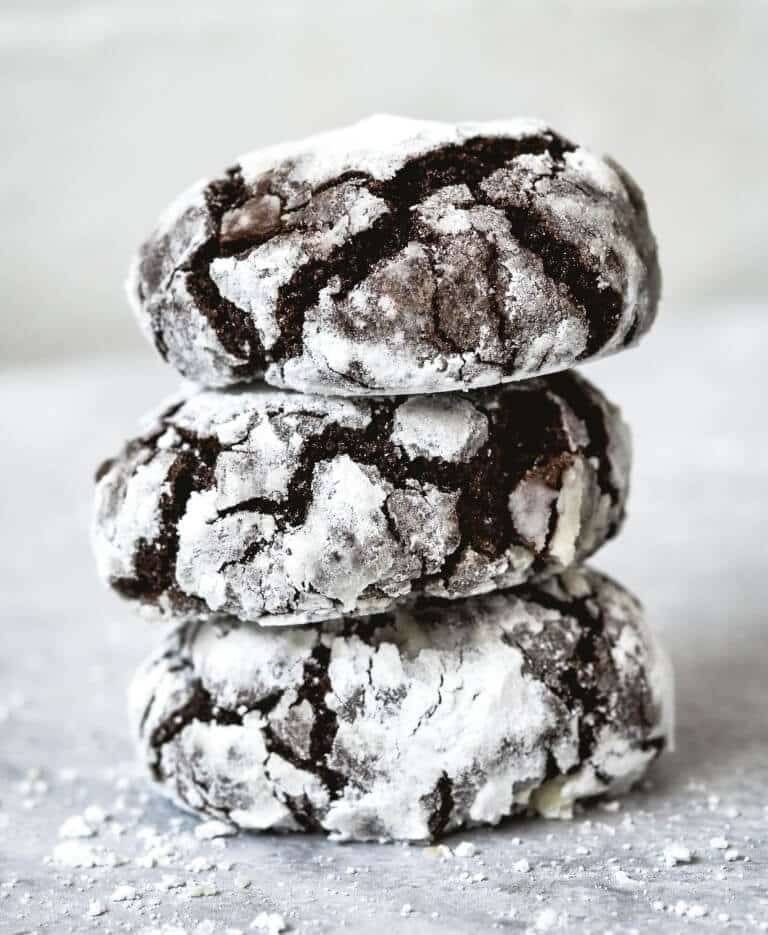 Photo of a stack of three Chocolate Snowstorm Cookies.