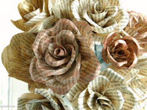 A photo of flowers made from pages of unwanted books.