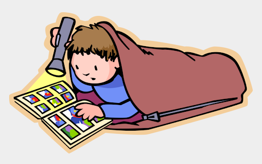child reading in sleeping bag with flashlight