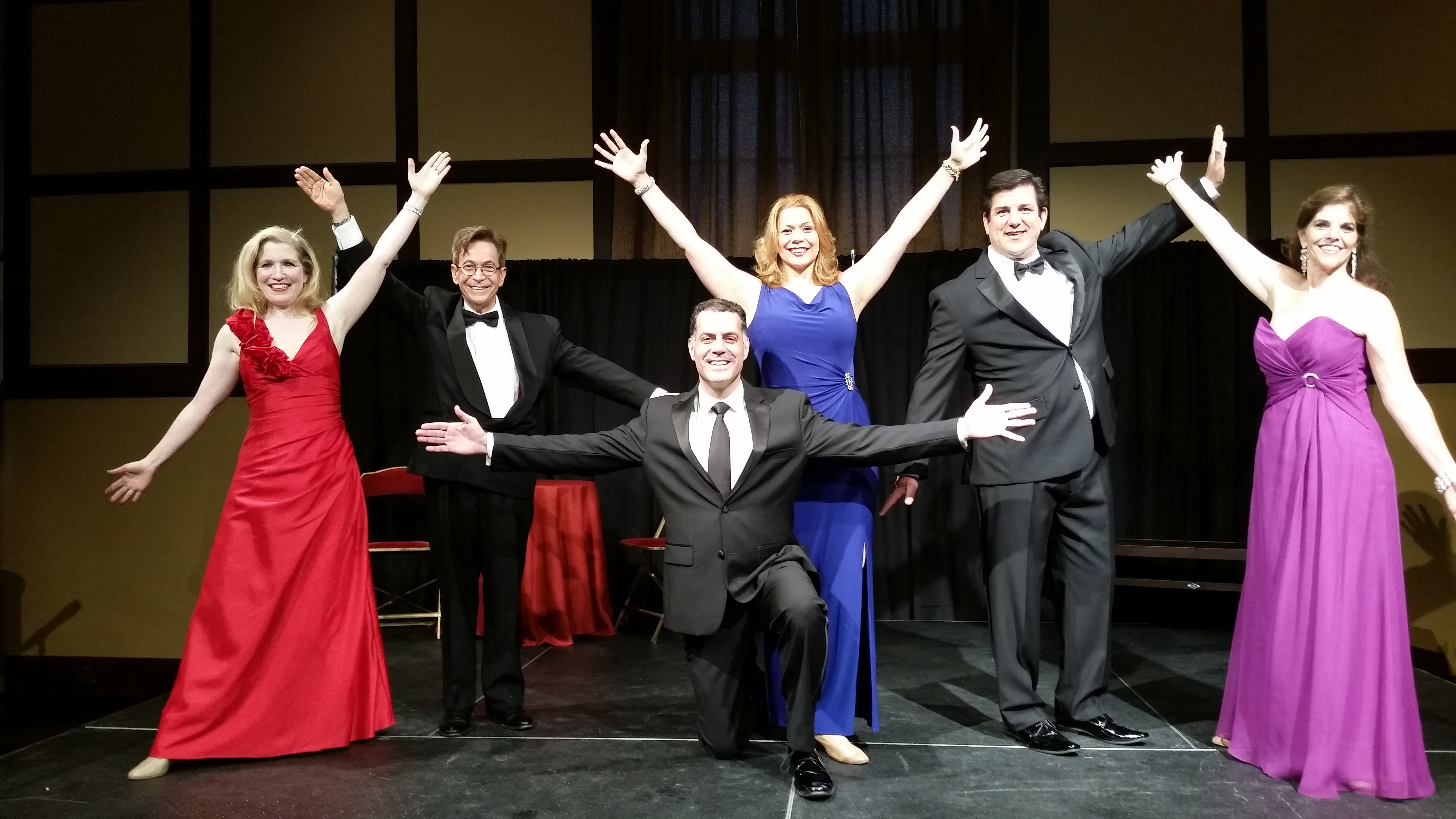A color photo of six performers of Broadway Showstoppers striking a pose on stage.