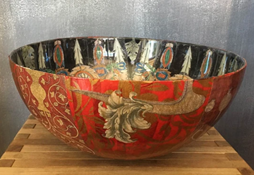 A color photo of a bowl decorated using the technique of decoupage.