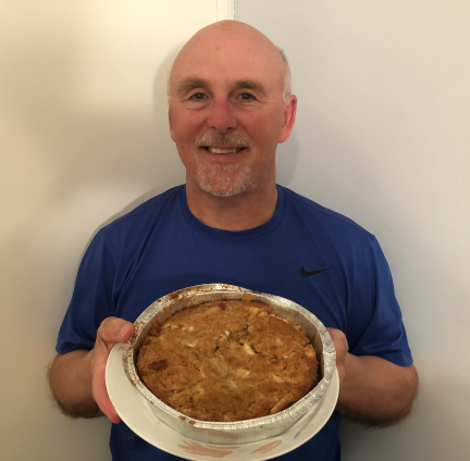 Photo of Chef Rob holding a plate of Harvest Apple Brownies.
