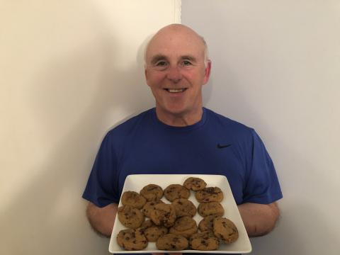 Photo of Chef Rob holding a plate of Pumpkin Chocolate Chip Cookies.