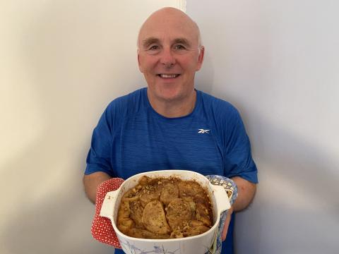 Chef Rob holding a dish of Praline French Toast Casserole.