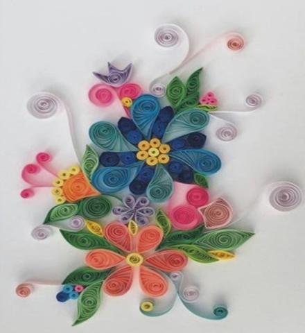 A color photo of flowers made using the technique of quilling.