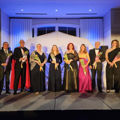 A color photo of singers from Opera Night Long Island on stage.