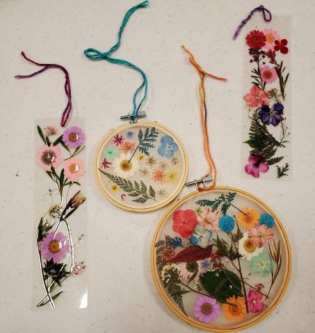 A color photo of crafts made with pressed flowers.