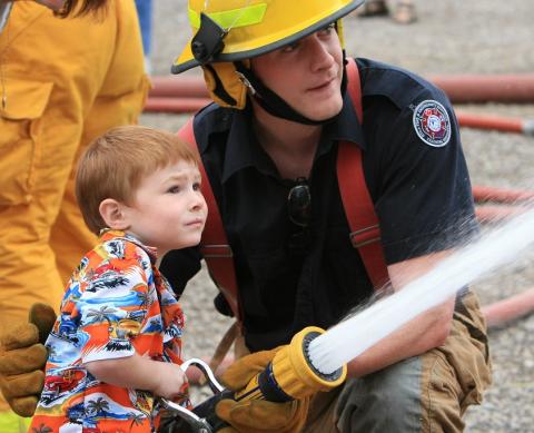 Kid using fire hose