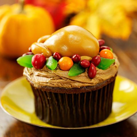 A color photo of a turkey cupcake.