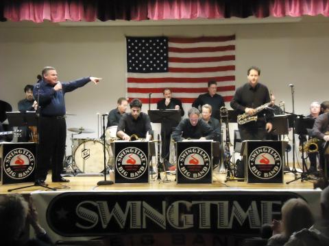 A color photo of the Swingtime Big Band on stage.