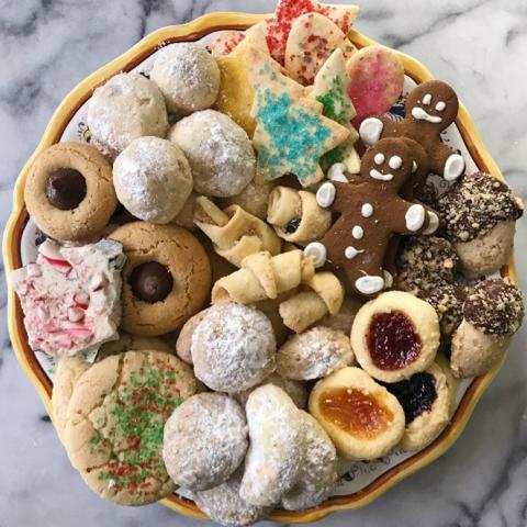 A color photo of a plate of holiday cookies.