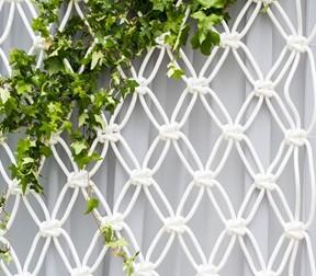 Photo of a macrame wall trellis.