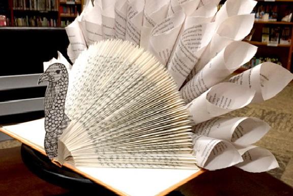 Photo of a turkey made from recycled book pages.