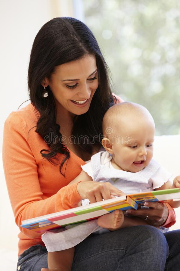 Mom reading to baby