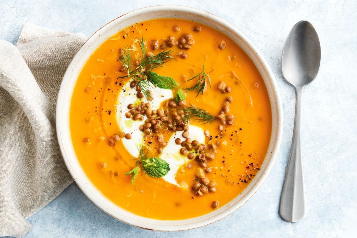 Photo of a bowl of sweet potato lentil soup.