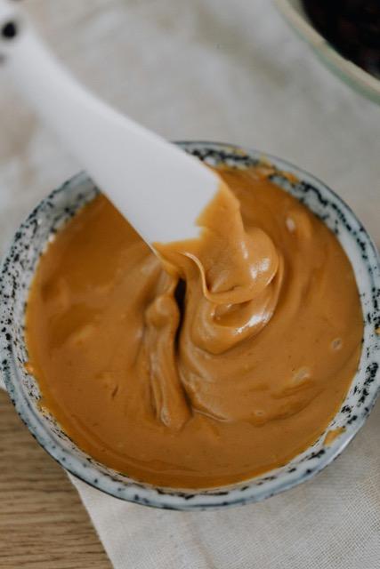 Photo of a bowl of peanut sauce.