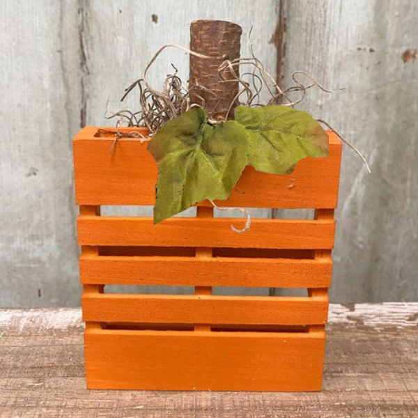 A color photo of a pumpkin crate.