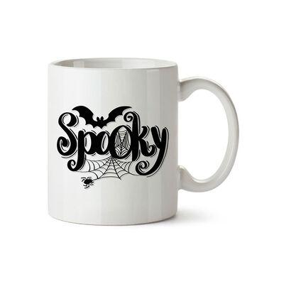 A photo of a white mug with the word spooky in black.