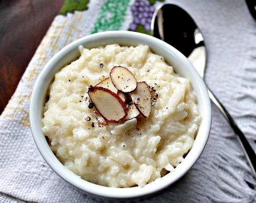 A color photo of a bowl of rice pudding.