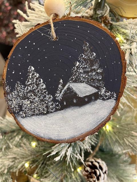 Photo of a painted wood ornament.