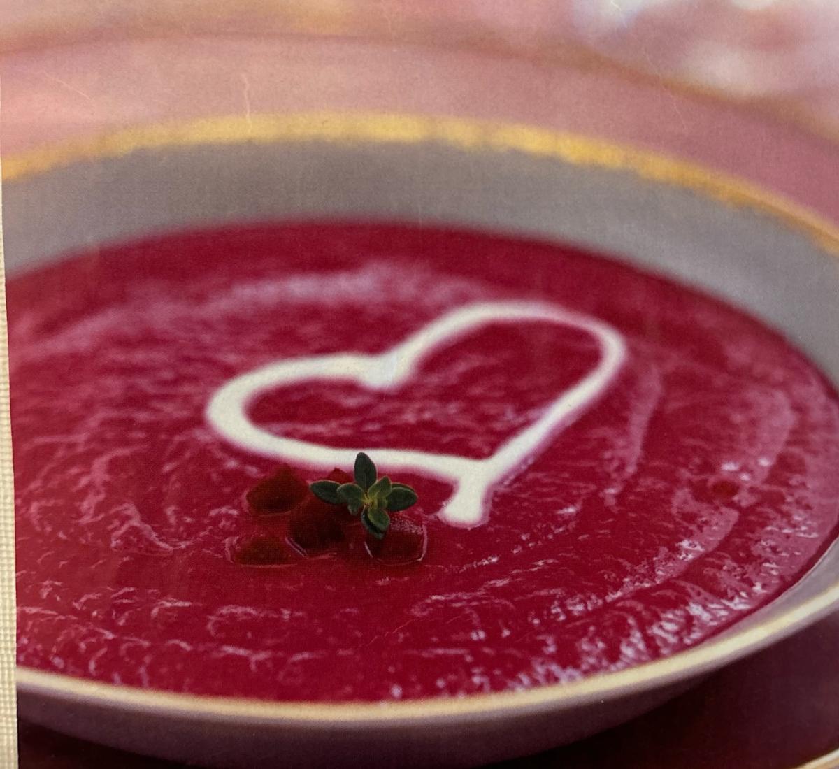 A color photo of a bowl of beet soup.